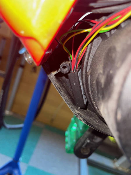 The Volspeed V4 tuning box tucked inside the frame.