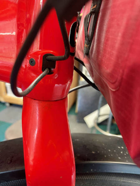 Cable exit port on the e-bike frame.